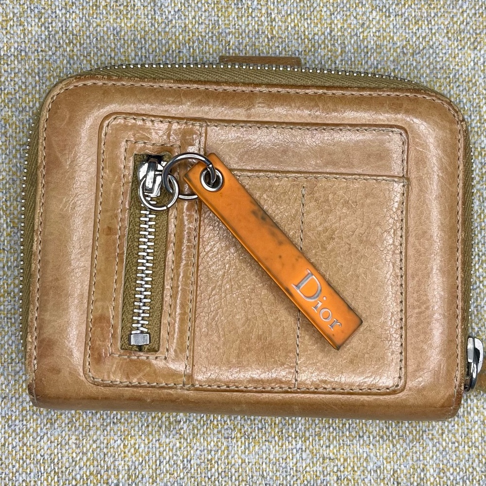 Christian Dior Remove before flight wallet.